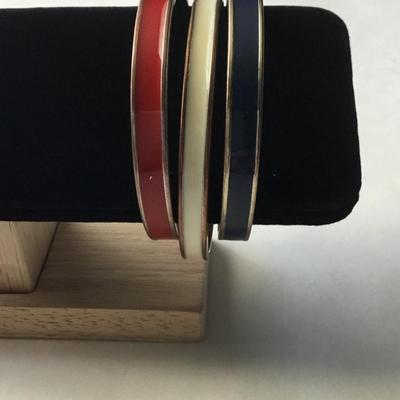 Three vintage gold tone plated red, white, and blue enamel hinged bangle bracelets
