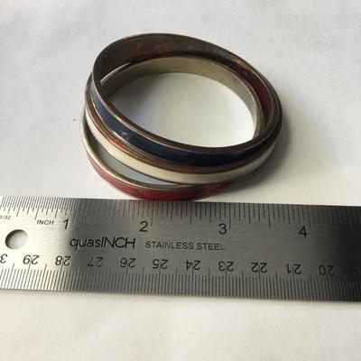 Three vintage gold tone plated red, white, and blue enamel hinged bangle bracelets