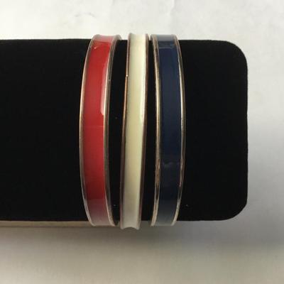 Three vintage gold tone plated red, white, and blue enamel hinged bangle bracelets