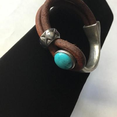 Bohemian leather type silver tone half cuff bracelet with a turquoise cabochon stone type