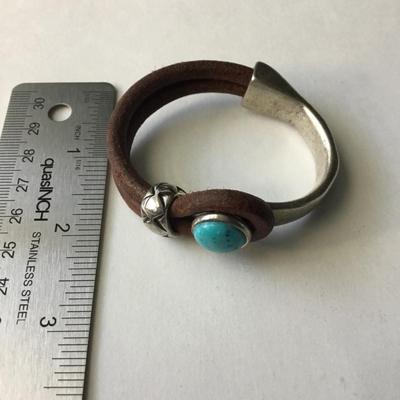 Bohemian leather type silver tone half cuff bracelet with a turquoise cabochon stone type