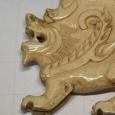 Bone carved pendant on leather necklace