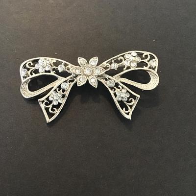 Sale Photo Thumbnail #48: Vintage silver tone rhinestone bow brooch Please see attached pictures