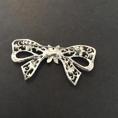 Sale Photo Thumbnail #50: Vintage silver tone rhinestone bow brooch Please see attached pictures