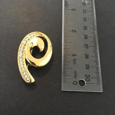 Sale Photo Thumbnail #56: Vintage Monet Gold Tone swirl brooch with clear crystals Please see attached pictures