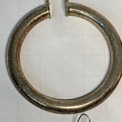 Three silver-tone earrings