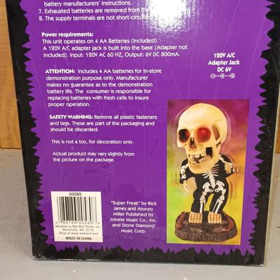 LOT 193: Empire Halloween Blow Mold Bear, Big Head Dancing Skeleton, Large Plastic Skull & More