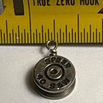 Elephant, lion rampant & bullet pendants