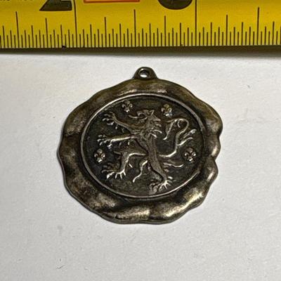 Elephant, lion rampant & bullet pendants