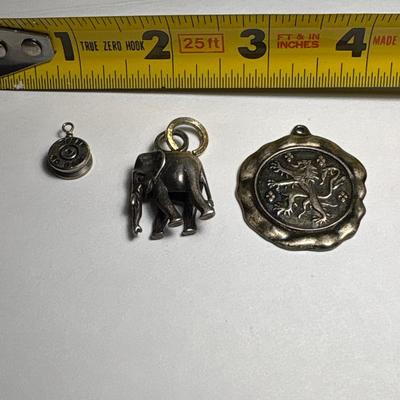 Elephant, lion rampant & bullet pendants