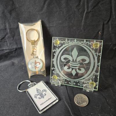 Sale Photo Thumbnail #376: This is for two Fleur de Lis Key Chains and Etched Glass Coaster.  All are unused.  The Key Chain is in its original package but the single coaster's box is torn.  A good gift for the Fleur de Lover.