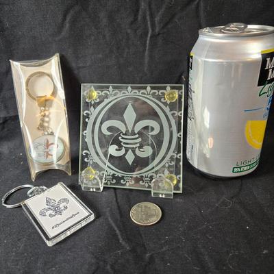 Sale Photo Thumbnail #373: This is for two Fleur de Lis Key Chains and Etched Glass Coaster.  All are unused.  The Key Chain is in its original package but the single coaster's box is torn.  A good gift for the Fleur de Lover.