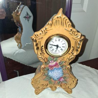 Sale Photo Thumbnail #26: Beautiful Floral Porcelain Clock. Approximately 8" tall. Works well. No chips cracks or breaks. Runs on batteries.