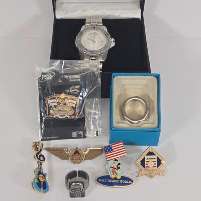 LOT 123: Ursinus College Athletics Watch, Multi-line Geometric Ring, and Various Pins