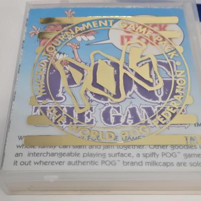 LOT 132: 1994 POG The Game World POG Federation Micro Tournament Game Pack, Numerous Pogs, and More