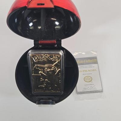 LOT 133: Ultimate Dice & Card Game Compendium, Pokémon 23k Gold Plated Trading Card, Unpunched Sheet of Official Magic: The Gathering...