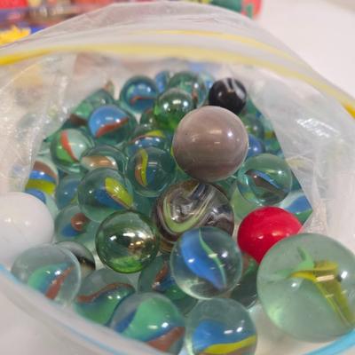 LOT 133: Ultimate Dice & Card Game Compendium, Pokémon 23k Gold Plated Trading Card, Unpunched Sheet of Official Magic: The Gathering...