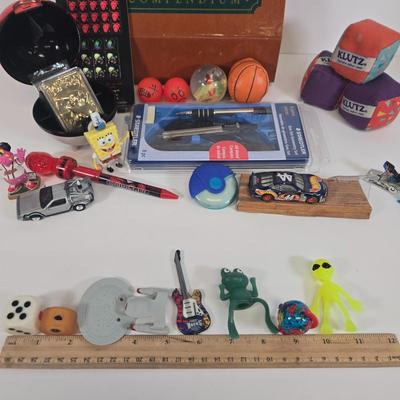 LOT 133: Ultimate Dice & Card Game Compendium, Pokémon 23k Gold Plated Trading Card, Unpunched Sheet of Official Magic: The Gathering...