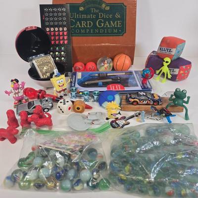 LOT 133: Ultimate Dice & Card Game Compendium, Pokémon 23k Gold Plated Trading Card, Unpunched Sheet of Official Magic: The Gathering...