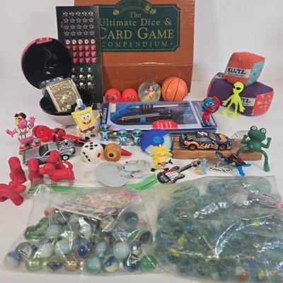 LOT 133: Ultimate Dice & Card Game Compendium, Pokémon 23k Gold Plated Trading Card, Unpunched Sheet of Official Magic: The Gathering...