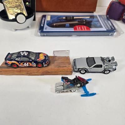 LOT 133: Ultimate Dice & Card Game Compendium, Pokémon 23k Gold Plated Trading Card, Unpunched Sheet of Official Magic: The Gathering...