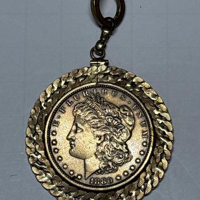 Gold tone 1880 $1 coin pendant