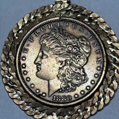 Gold tone 1880 $1 coin pendant