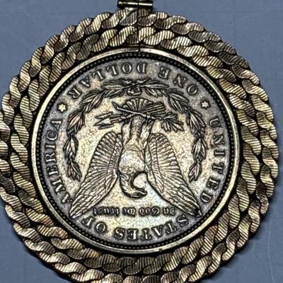 Gold tone 1880 $1 coin pendant