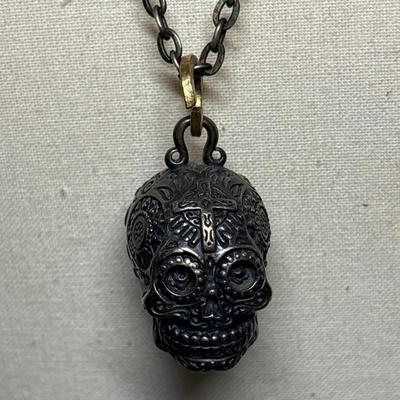 Silver skull pendant on chain