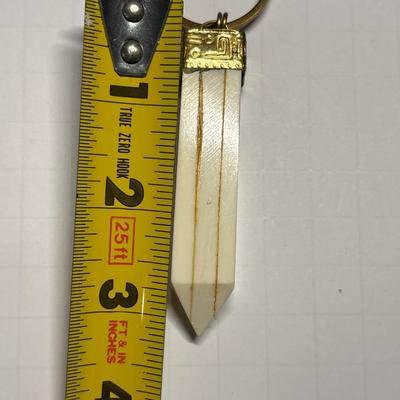 Ivory colored obelisk pendant in beaded chain