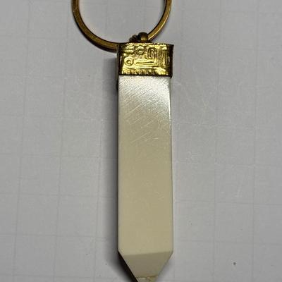 Ivory colored obelisk pendant in beaded chain