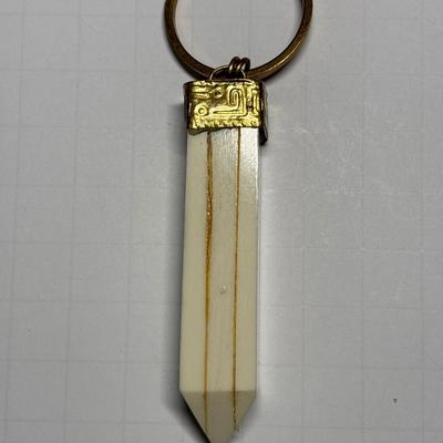 Ivory colored obelisk pendant in beaded chain