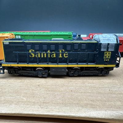 Vintage HO Scale Model Train Lot – Locomotives, Freight Cars, Track & Power Packs. HO Scamm