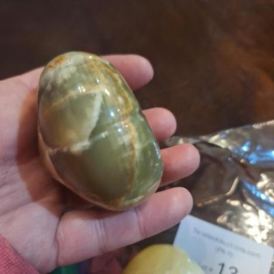 polished onyx fruit, 1 is an apple- the other two maybe a tomato?  We don't know.