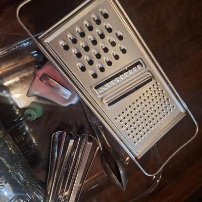 Cake pan, flour sifter, egg beater, cheese grater and other items