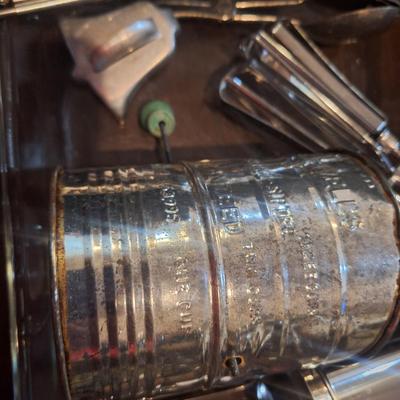 Cake pan, flour sifter, egg beater, cheese grater and other items