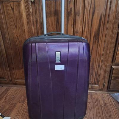 Delsey spinner large luggage in purple- hard case, 4 wheels spins smoothly