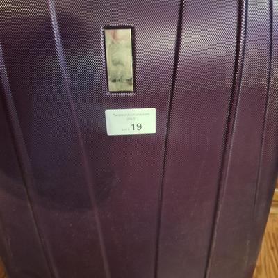 Delsey spinner large luggage in purple- hard case, 4 wheels spins smoothly