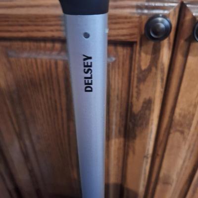 Delsey spinner large luggage in purple- hard case, 4 wheels spins smoothly