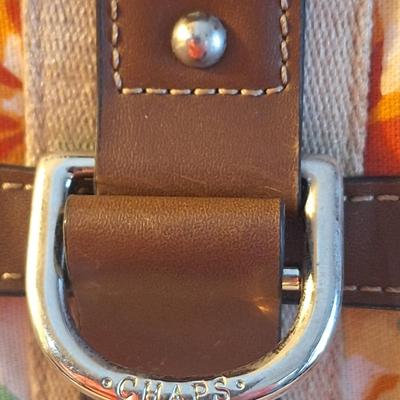 Chaps floral canvase crossbody bag with faux leather trim.