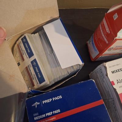 bundle of alcohol prep pads and some gauze pads