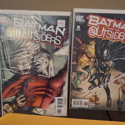  two issues of the DC comic book series Batman and the Outsiders 
