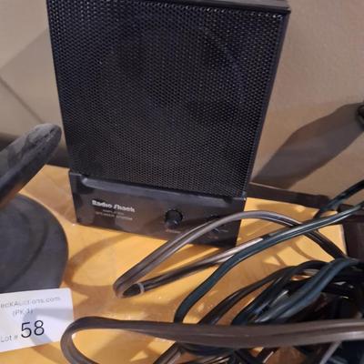 mini speaker, an ext cord and rabbit ears antenna