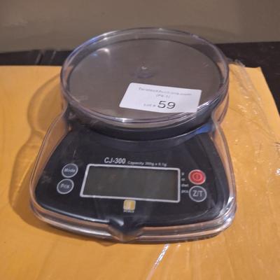 mini scale -tested and works, needs 3 AAA batteries,  weights small items -perfect for resllers shipping items under 6-7 pounds  or use...