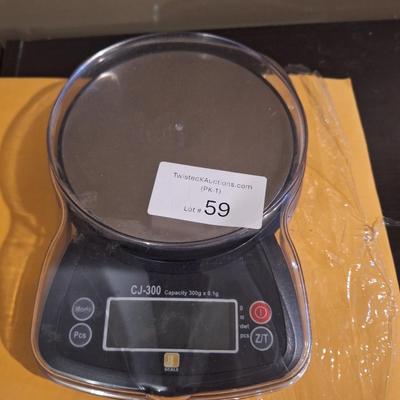 mini scale -tested and works, needs 3 AAA batteries,  weights small items -perfect for resllers shipping items under 6-7 pounds  or use...