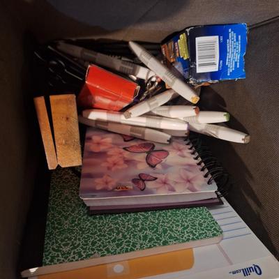 fabric container fo misc office items, markers, half full spiral notebooks, full writing pad, random things, 