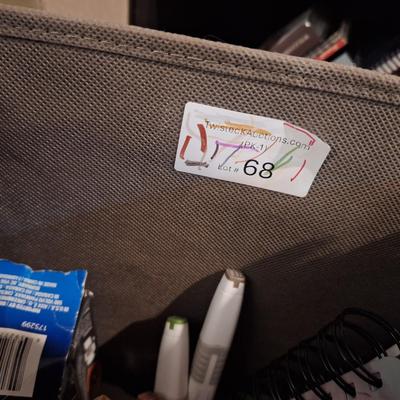 fabric container fo misc office items, markers, half full spiral notebooks, full writing pad, random things, 