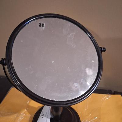 dual-magnification swivel vanity mirror  one side has 3x magnifaction.