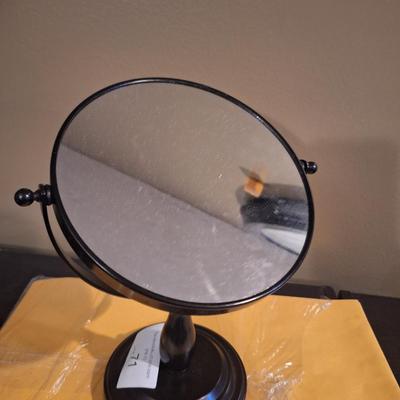 dual-magnification swivel vanity mirror  one side has 3x magnifaction.