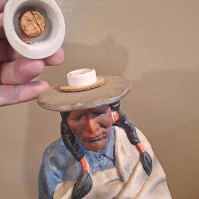 Lionstone "Proud Indian" (or "Casual Indian") porcelain whiskey decanter. -empty